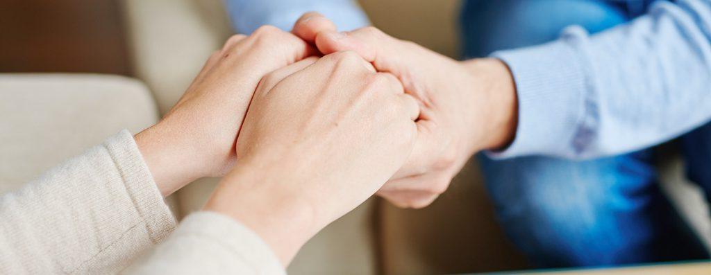 photo of holding hands in support